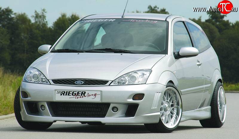 8 899 р. Передний бампер Rieger  Ford Focus  1 (1998-2005) седан дорестайлинг, универсал дорестайлинг, хэтчбэк 3 дв. дорестайлинг, хэтчбэк 5 дв. дорестайлинг, седан рестайлинг, универсал рестайлинг, хэтчбэк 3 дв. рестайлинг, хэтчбэк 5 дв. рестайлинг  с доставкой в г. Йошкар-Ола